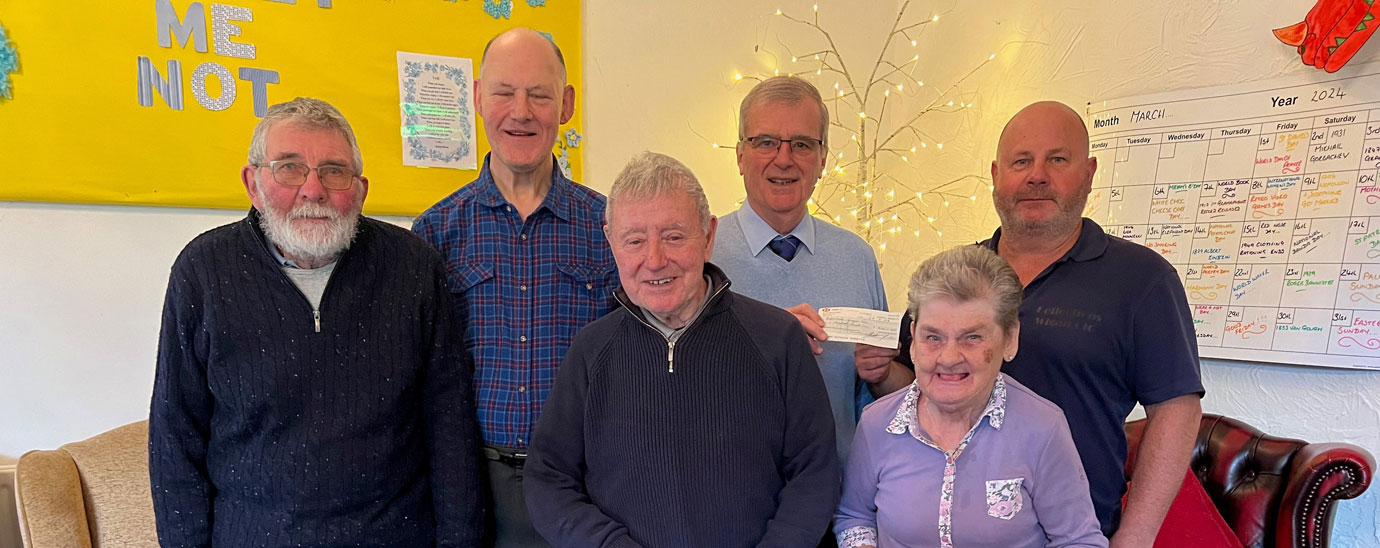 Pictured from left to right on the back row, are: John Mason and John Selley (from Wigan Group Freemasons) and Duncan Edwards (owner/manager of Reflections) stood behind three service users. 