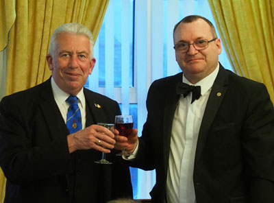Mark Matthews (left) takes wine with Paul Potter at the festive board.