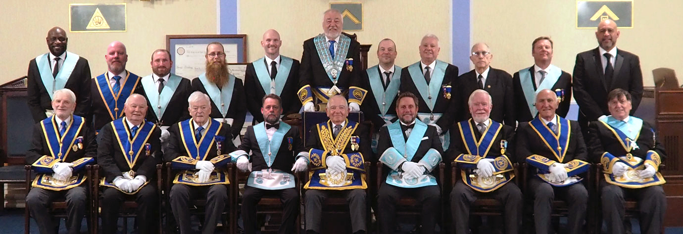 Ian Fowler (WM centre standing) with the members of the lodge.