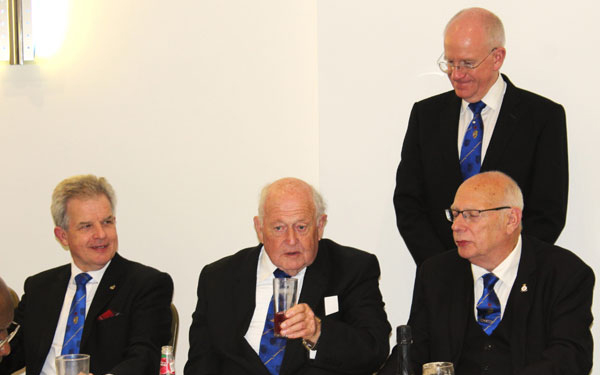 Phil Holland (centre) responding to his toast, flanked by Stuart Boyd (left), Noel Grubb (right) and Peter Littlehale (standing).
