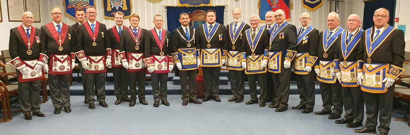 David Thomas (centre) surrounded by an impressive line-up of acting Provincial grand officers.