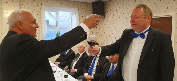 John Darrell (left) toasts Andy Greenlees during the Master’s Song.