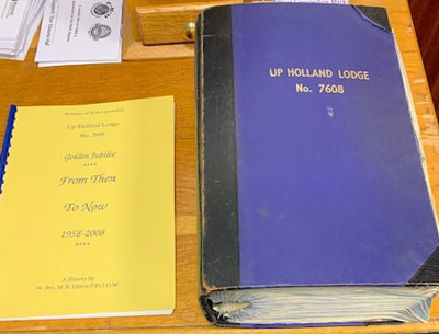 The original minute book of Up holland Lodge from 1974 when Mike was initiated along with a booklet produce by Mike celebrating the golden jubilee of Up Holland Lodge in 2008