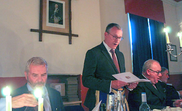 Ian Sanderson sings ‘God Bless the Prince of Wales’ by candlelight.