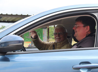 Phil in the driving seat, sets off with his driving instructor around the track.