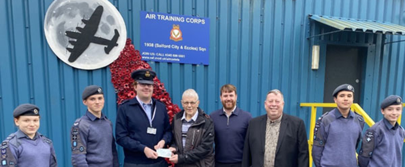 Paul Webster presenting the cheque to Squadron Leader Sgt L Masters.