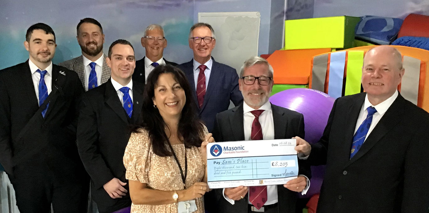 Pictured from left to right, at the rear are: Jon Boriss, David Jenkinson, Adam Turner, Neil Higgins and John Robbie Porter. Front row, left to right: Stephanie Woodhead receiving the MCF cheque from Robert Marsden and Duncan Smith.