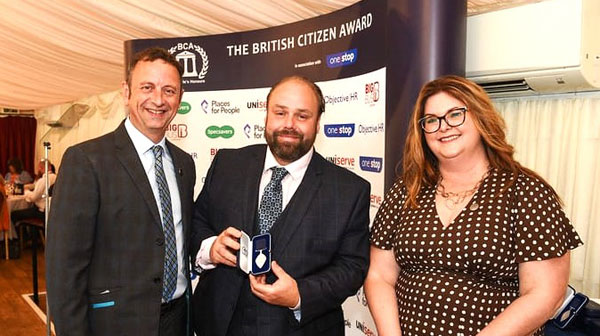 Ezra (centre) receiving his award from Matt Allright and BCA’s Stephanie Wood.