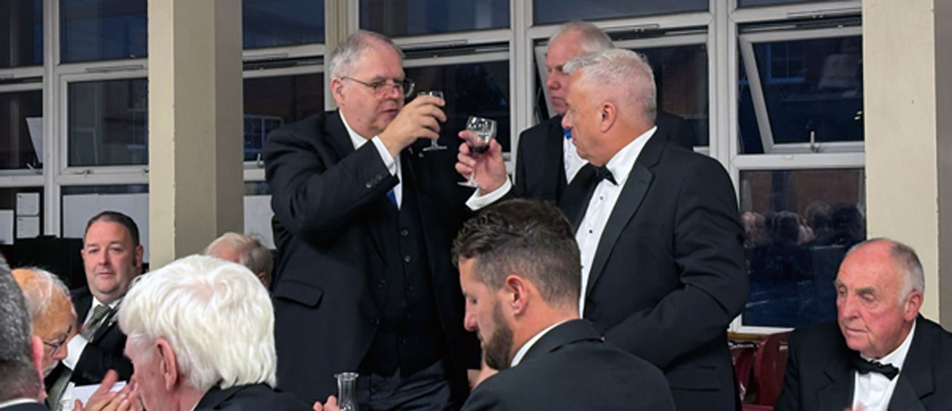 John Topping (right) toasts with Neil Ward as the principal guest.