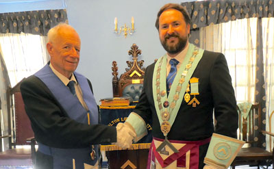 Stewart Cranage (left) welcomed by WM Michael Daly.