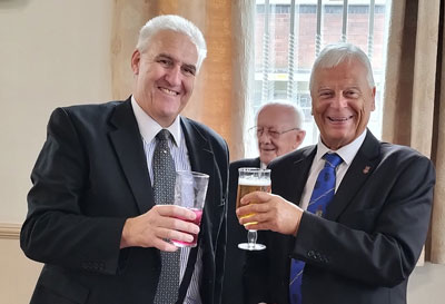 Andy toasts Mick at the festive board.