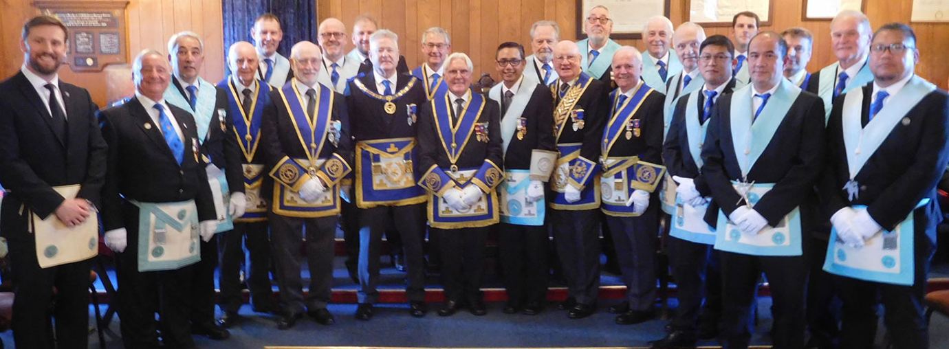 Owen Osmotherley (centre) surrounded by members and guests of Dalton-in-Furness Lodge.