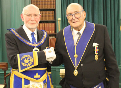 John James (left) congratulates Steven Freedman.