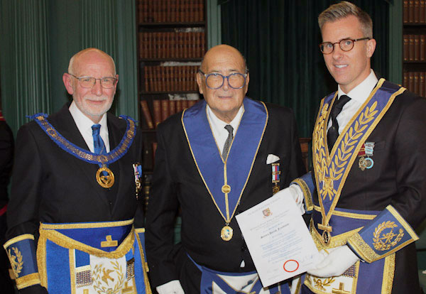 Pictured from left to right, are: John James, Steven Freedman and Paul Storrar presenting the certificate.