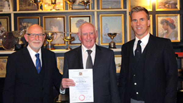 Pictured from left to right, are: John James, Trevor Brooks with his golden jubilee certificate and Paul Storrar.