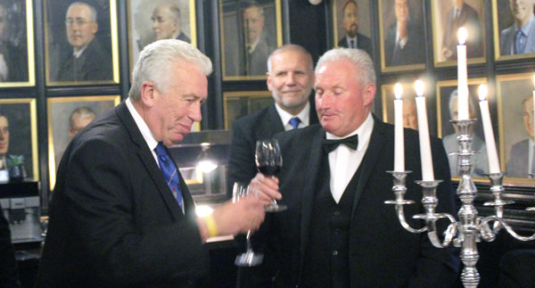 Mark Matthews (left) receiving the toast from Peter Wall