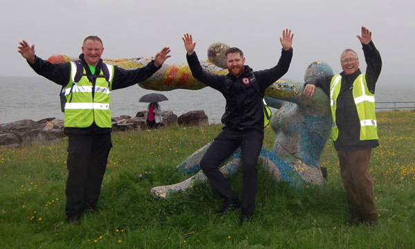 Pictured from left to right, are: Chris Wilkinson, Robert Wilkinson and John Holmes in front of the Venus and Cupid sculpture, (subtitled ‘Love, The Most Beautiful of Absolute Disasters’).