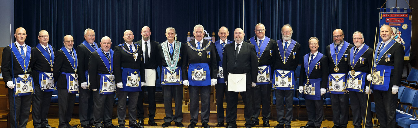 Mark (centre) accompanied by officers of the lodge, grand and Provincial grand officers