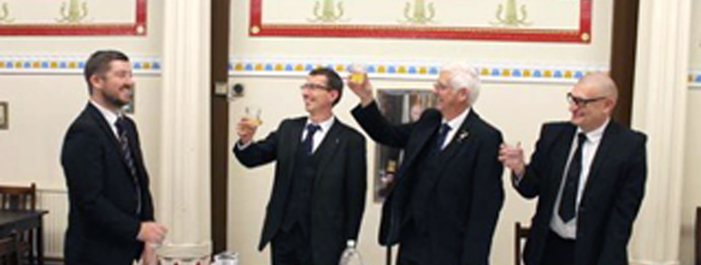 The three principals toasting newly exalted companion Jonathan Tyrer (left)