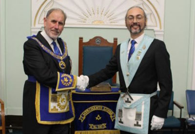 Frank Umbers (left) congratulates Joshua Adatoz.