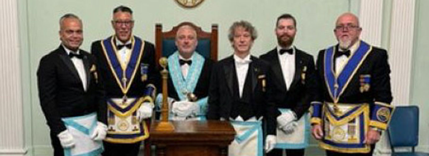 The SW Stuart Virgo (seated), with Jorge Perez (second left) and Steve Crane (right) together with the three Dutch visiting brethren.