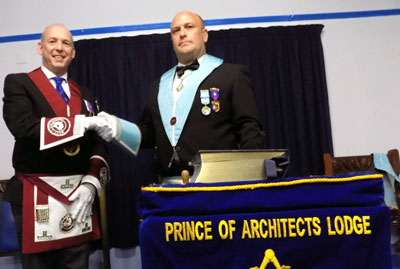 Master elect Michael Fox (left) with installing master Mark Davis.