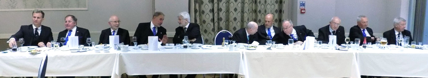 Brethren on the top table enjoying the festive board. 