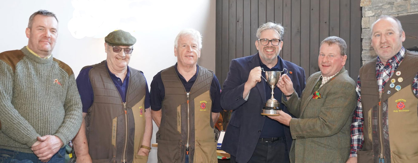 Richard Dennison receiving the Inter Provincial Shooting Society Cup from John Thompson alongside the West Lancashire team. Pictured from left to right, are: Jason Rhodes, Mike Casey, Dave Smith, John Thompson, Richard Dennison and Andy McClements