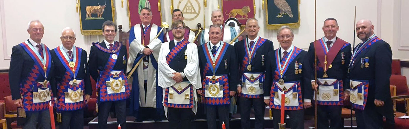 Callum (centre), surrounded by the senior officers of the lodge and the Provincial team.