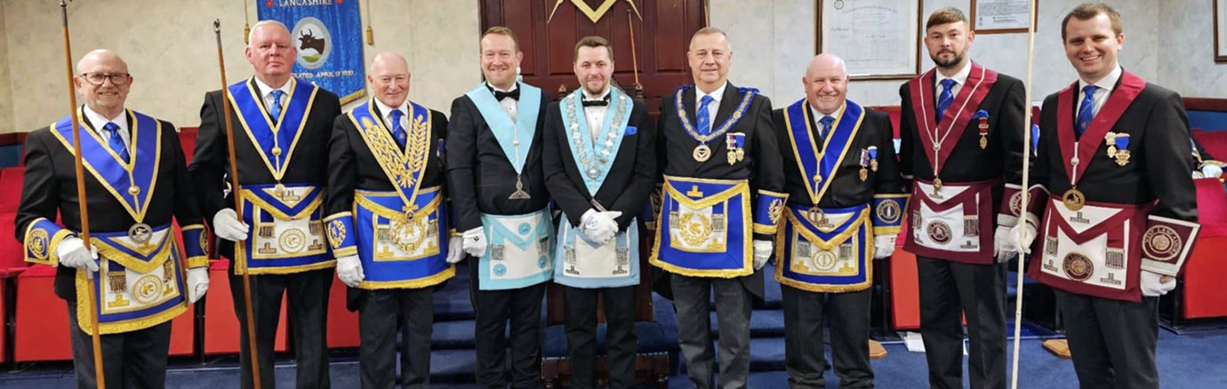 Grand and acting Provincial grand officers with David Peacock (fourth left), Jonathan Battersby (entre), Peter Lockett (fourth right) and Mike Silver (third right)