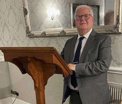 Alex Prescott preparing for his lecture at the lectern donated by Gary Smith.