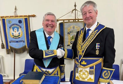 Bob Norris (left) is congratulated by Stephen Gregory.