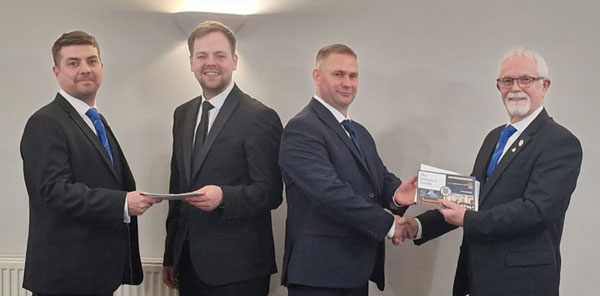 Pictured from left to right, are: Keith Lindsay presenting welcome a pack to Richard Walker, Carl Carrington and Paul Brunskill presenting welcome a pack to Carl