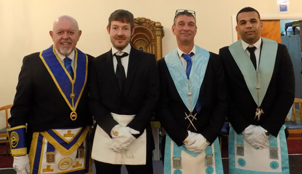 Pictured from left to right, are: Gary Evans with initiate Adrian Peasant and promotes David Jackson and Gareth Griffin.