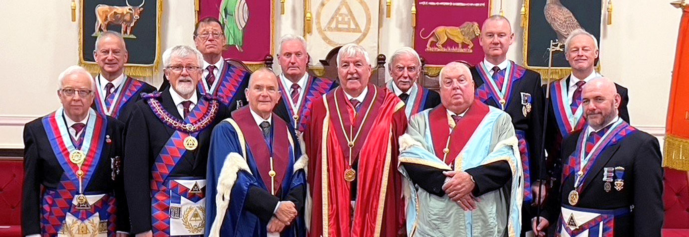 The newly installed principles surrounded by esteemed visitors.