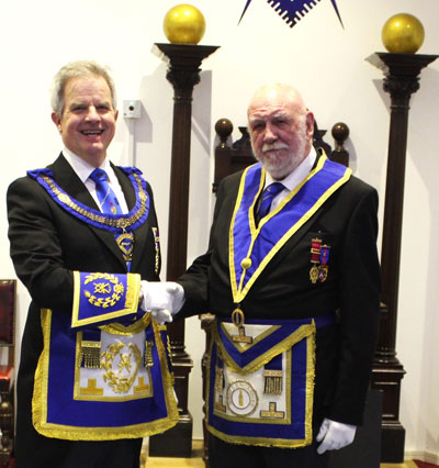 Malcolm Wilkins (right) being congratulated by Stuart Boyd.