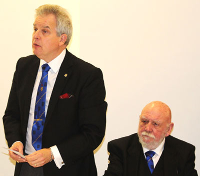 Stuart addresses the brethren, watched on by Malcolm.