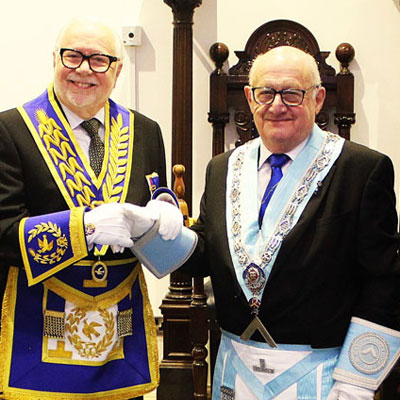 Mike Adams (left) congratulates Ken Harding.