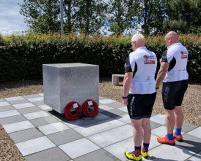 John (left) and Neil laying a wreath.