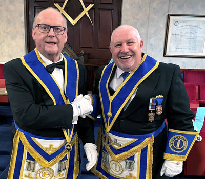 John Cunliffe (left) being congratulated by Mike Silver.