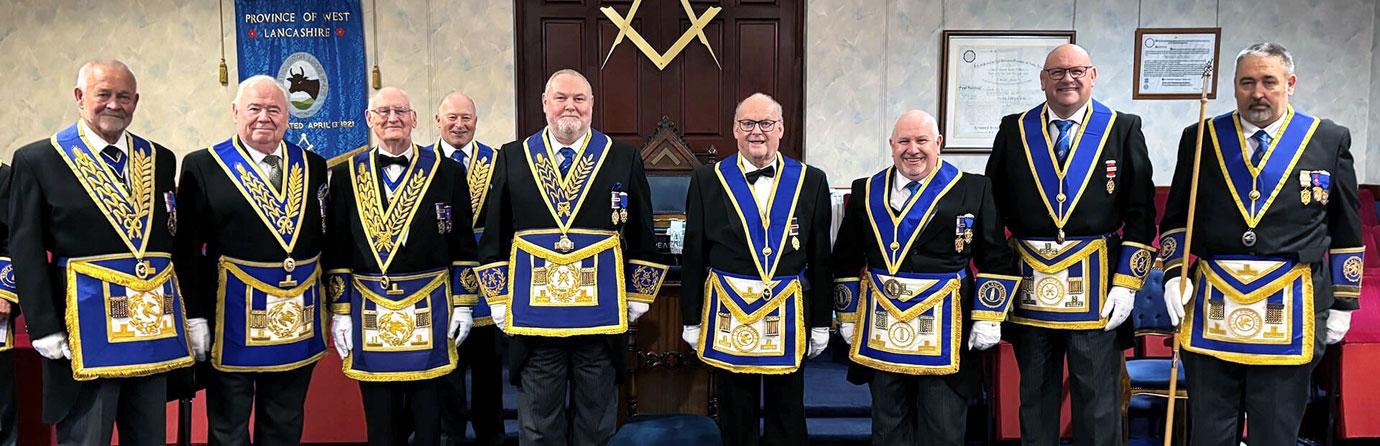 Gary Smith and John Cunliffe (centre) with acting and grand officers.