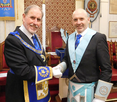 Frank Umbers congratulates Mark Hornby on attaining the master’s chair at Lodge of Furness.