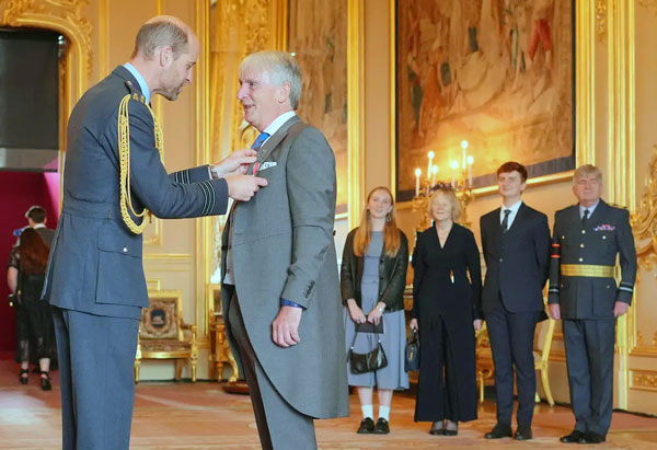 Prince William and Peter Dyer OBE.