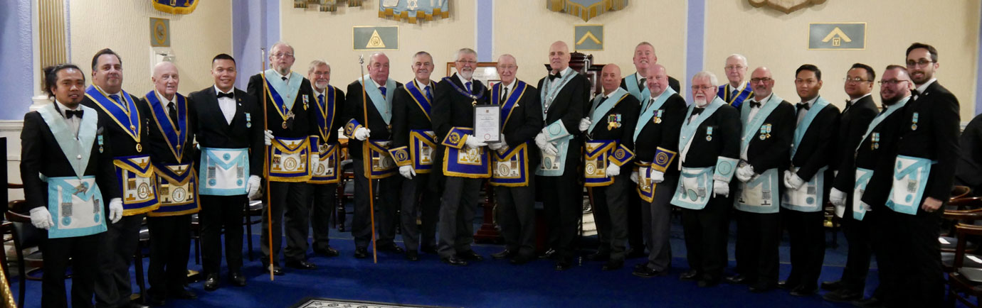 Clive Chenery (centre) with members of Progress Lodge and guests.