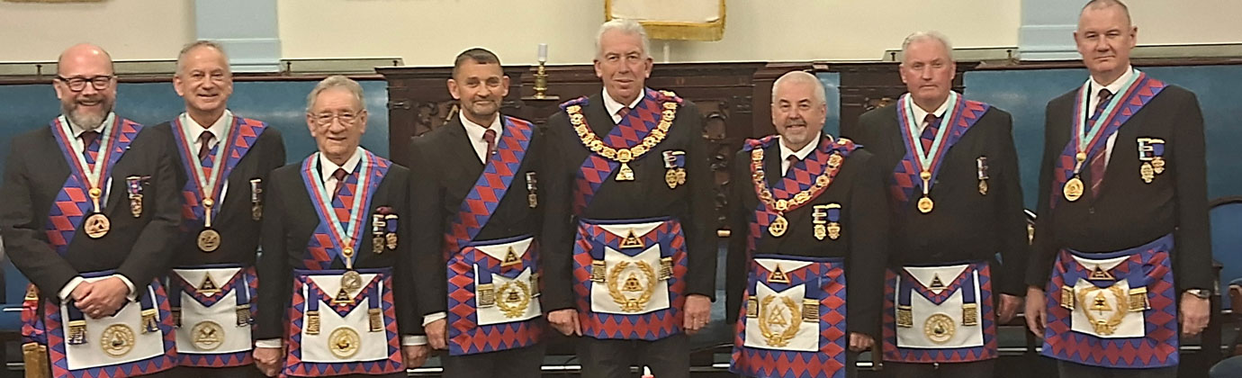 Mark Matthews (centre), surrounded by attending grand and Provincial grand officers.