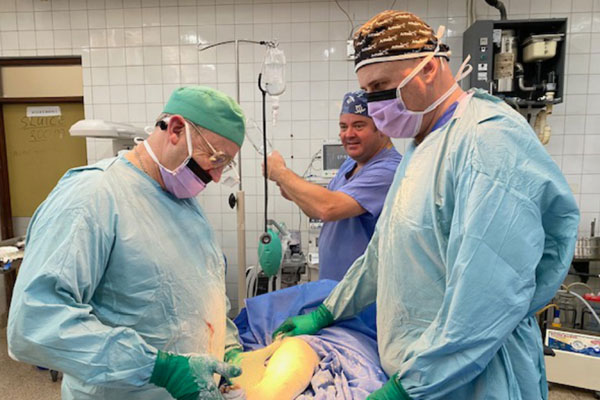 Pictured from left to right, are: Steve Mannion, Alan Monks and Clive Chenery performing a surgical procedure.