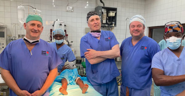 Pictured from left to right, are: Steve Mannion, Clive Chenery, Alan Monks and the theatre nurses.