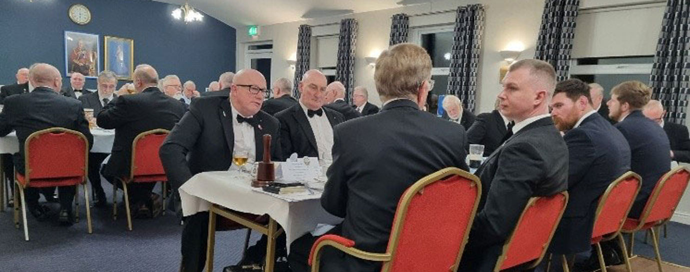 Diners at festive board.