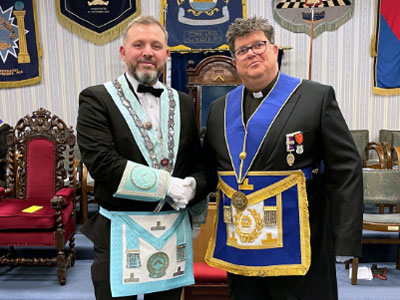 Canon John Hall (right) congratulating new WM David Hodge