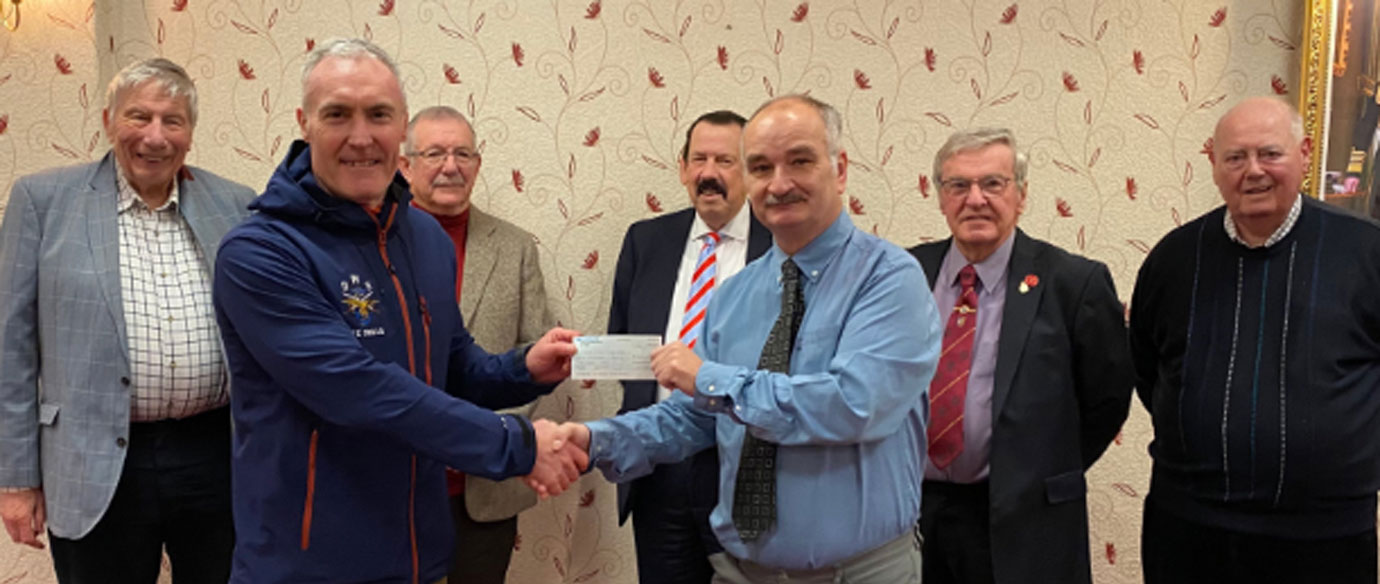 Pictured from left to right, are: Michael Dickinson, Dave Whitworth, Steve Willingham, Norman Thomas,Shaun Haynes (presenting a cheque to Dave Whitworth), Derek Broadbent and Ray Bird. 